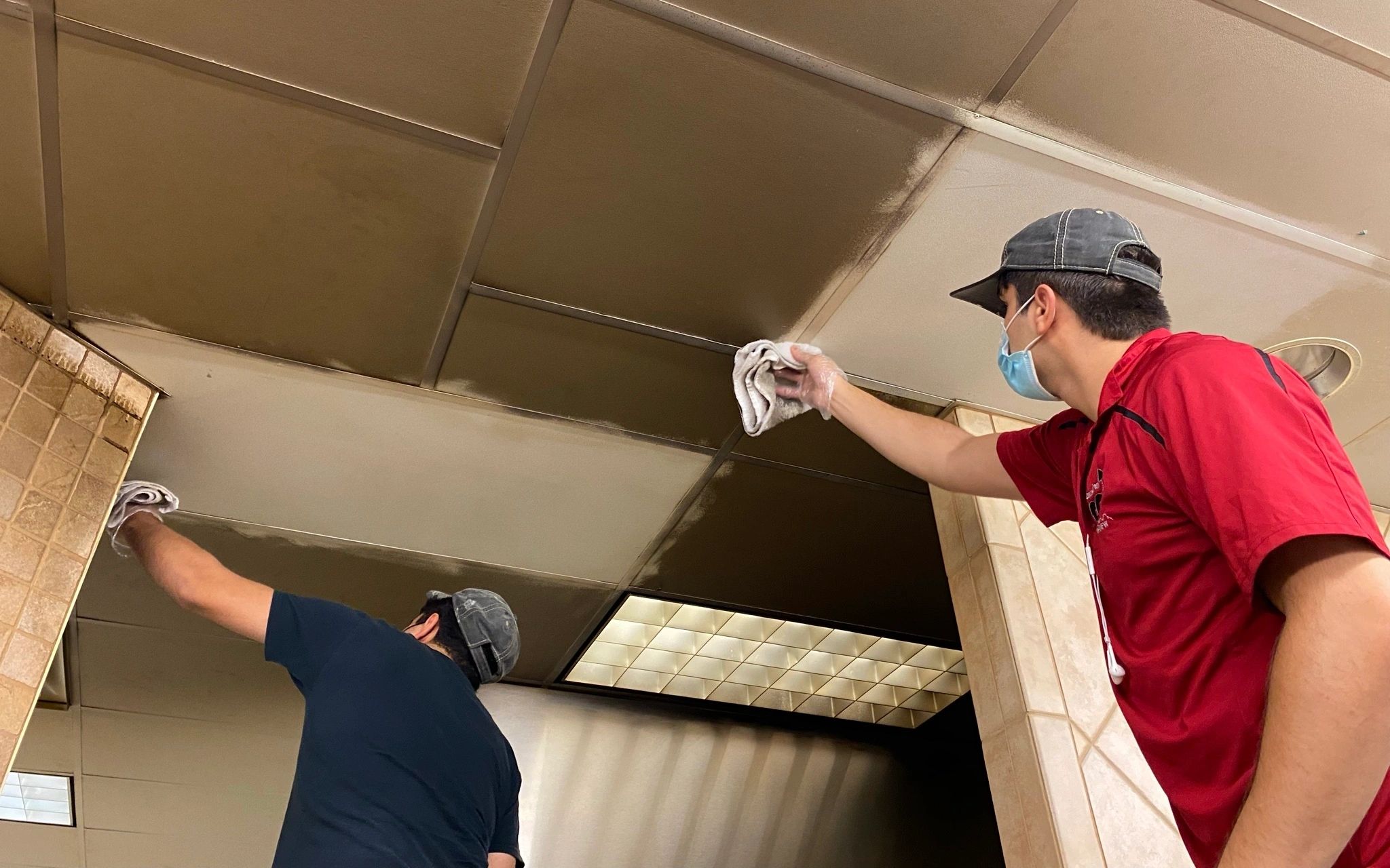 Cleaning dirty ceiling tiles